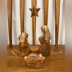 This is a handcrafted olive wood nativity set. 
The set includes figures of Mary
